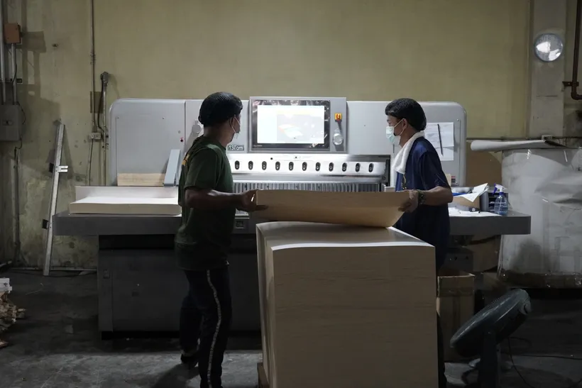 Fil-Anchor staff processing paper stock